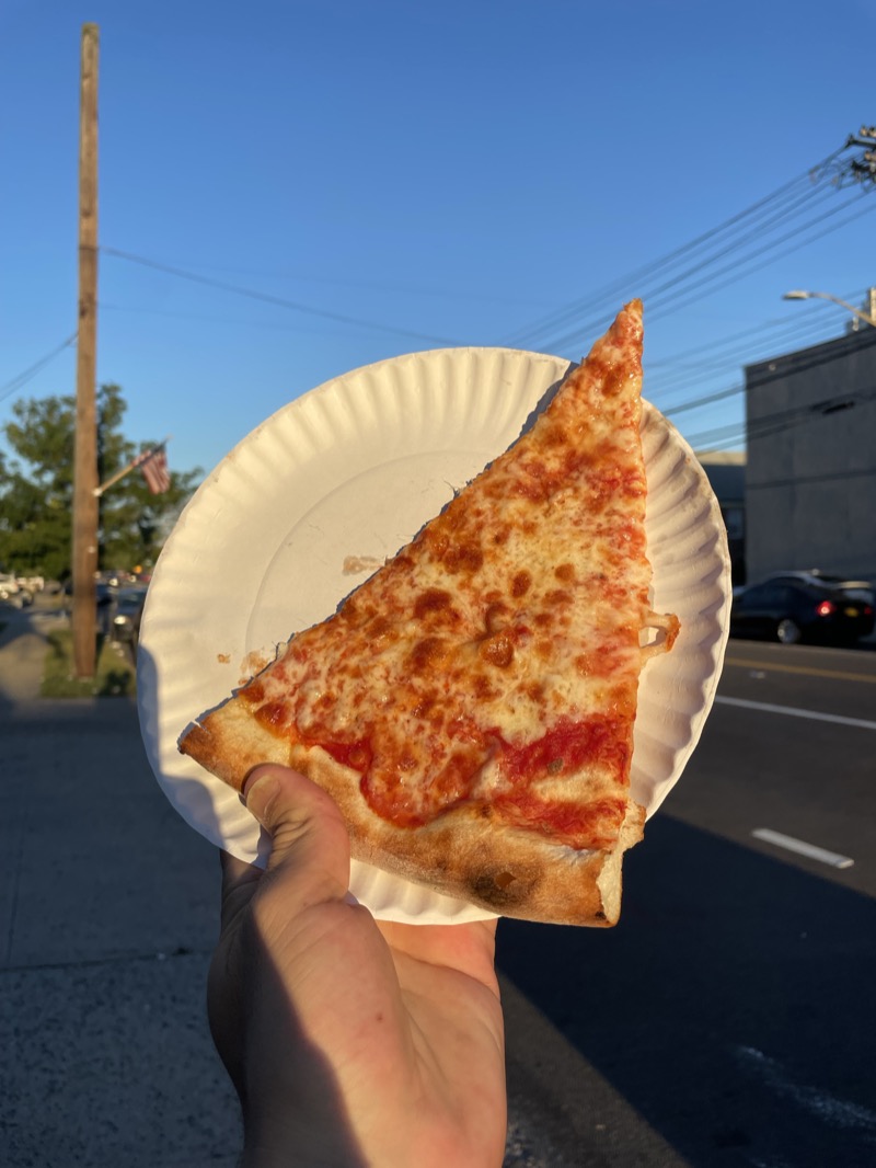 A broad New York-style cheese slice